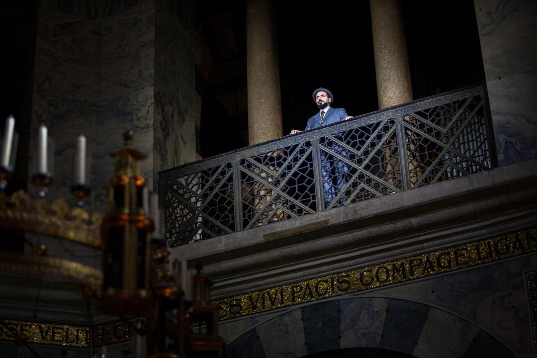 A man singing in a cathedral